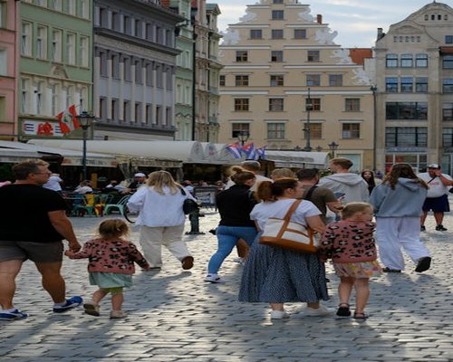 A calm, unhurried walk down a cobblestone street in Wroclaw