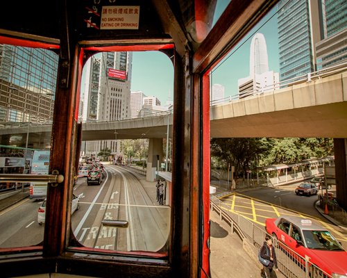 Passenger looking out the window of a tramway